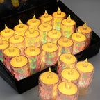 Several flameless electronic candles casting a soft glow on a reflective surface.