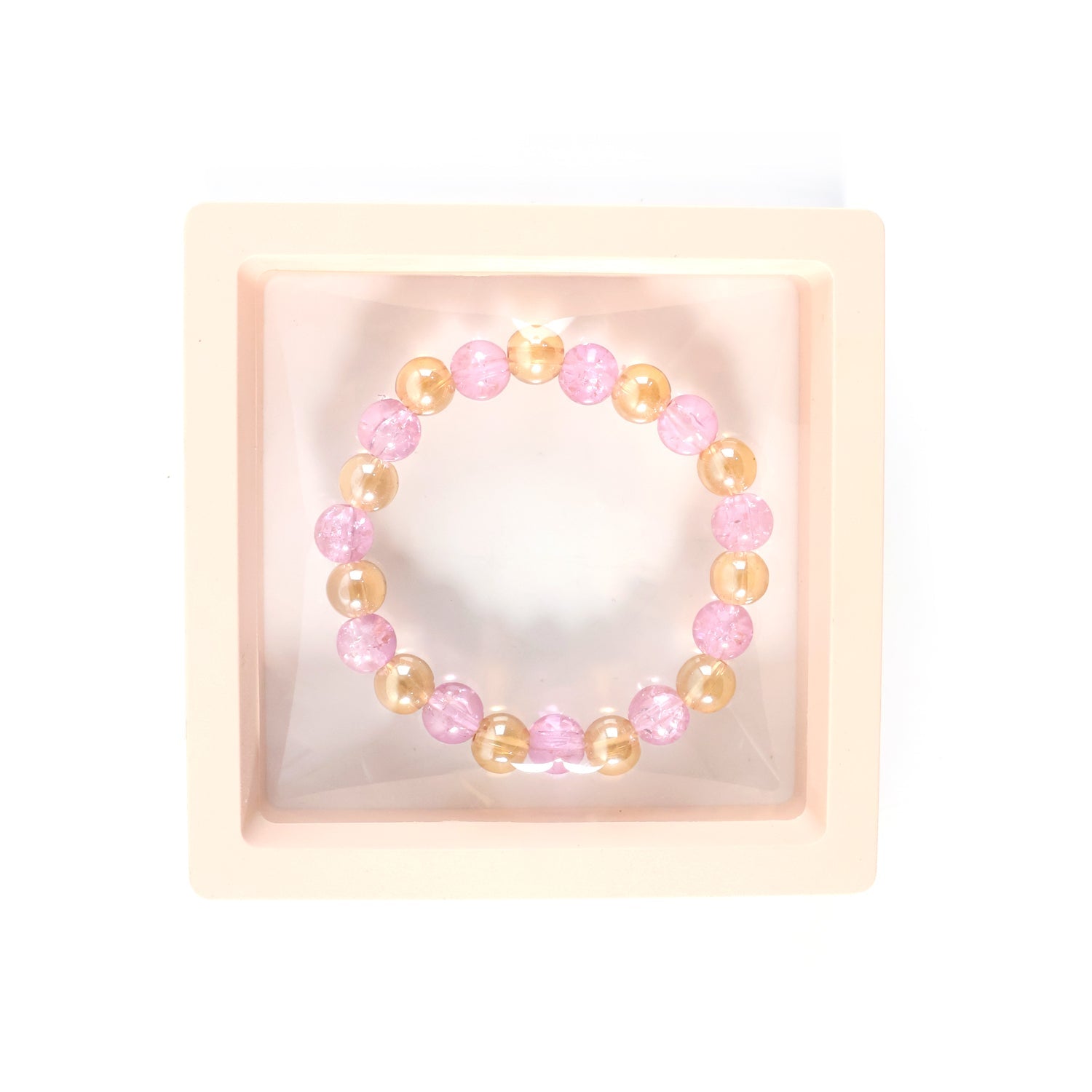 Transparent crystal beads enhancing the dual-tone stretch bracelet's look