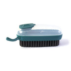 Close-up of the dispensing laundry cleaning brush in use