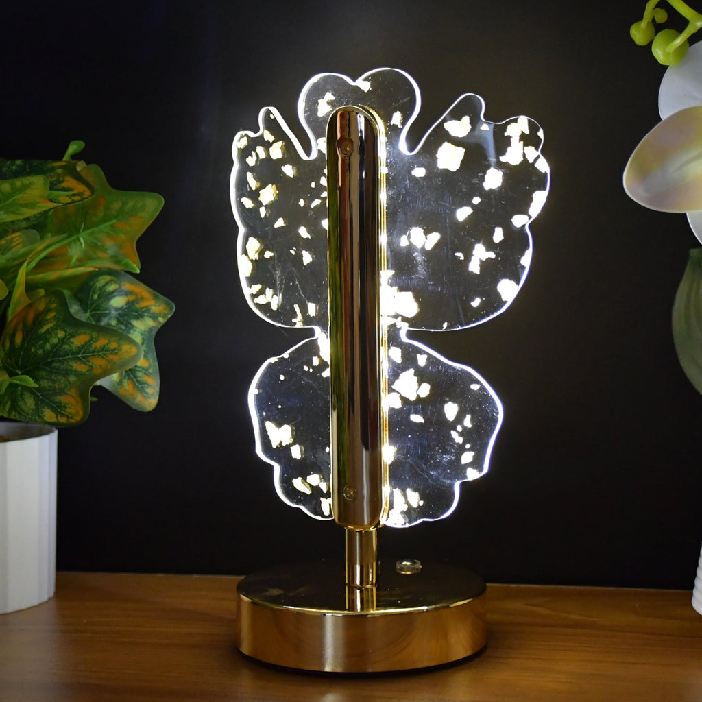 Side view of decorative golden crystal LED table lamp with butterfly motif