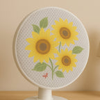 Mesh fabric showing sunflower design on fan cover