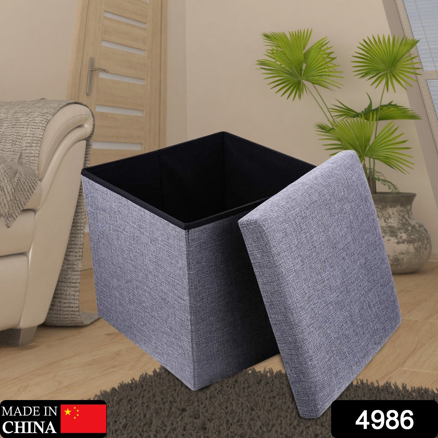 The Organivo storage stool shown open, revealing ample interior space for storing books and household items.