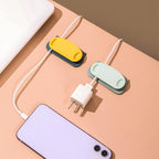 Pig plug wire organizer clips secured on glass surface