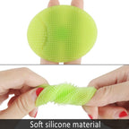 Pair of soft silicone facial cleansing brushes, highlighting their compact size.