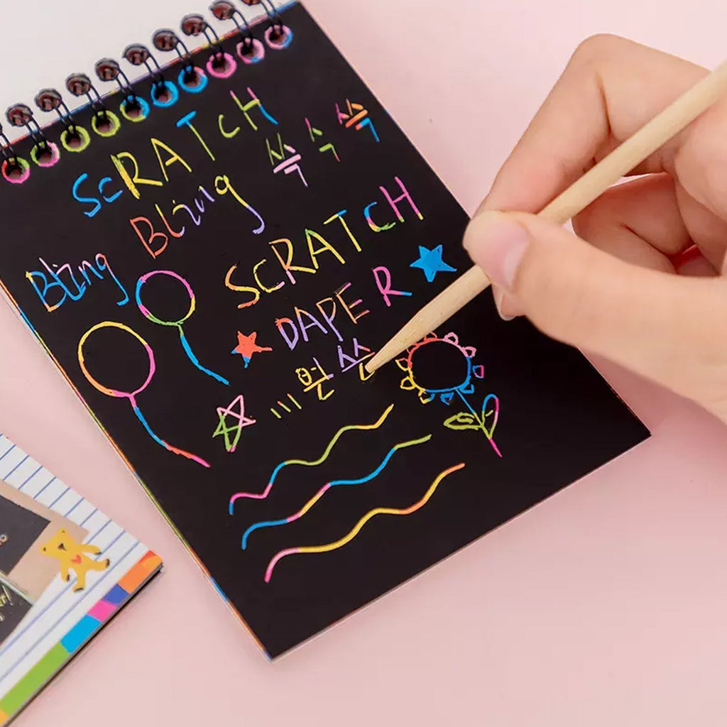 Multiple rainbow art scratch books stacked, emphasizing the pack of 10 pages.