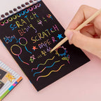 Multiple rainbow art scratch books stacked, emphasizing the pack of 10 pages.