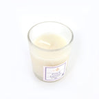 Top view of French Lavender soy candle glowing with warm flame