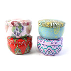 Decorative metal candle container with mandala print and tight-fitting lid