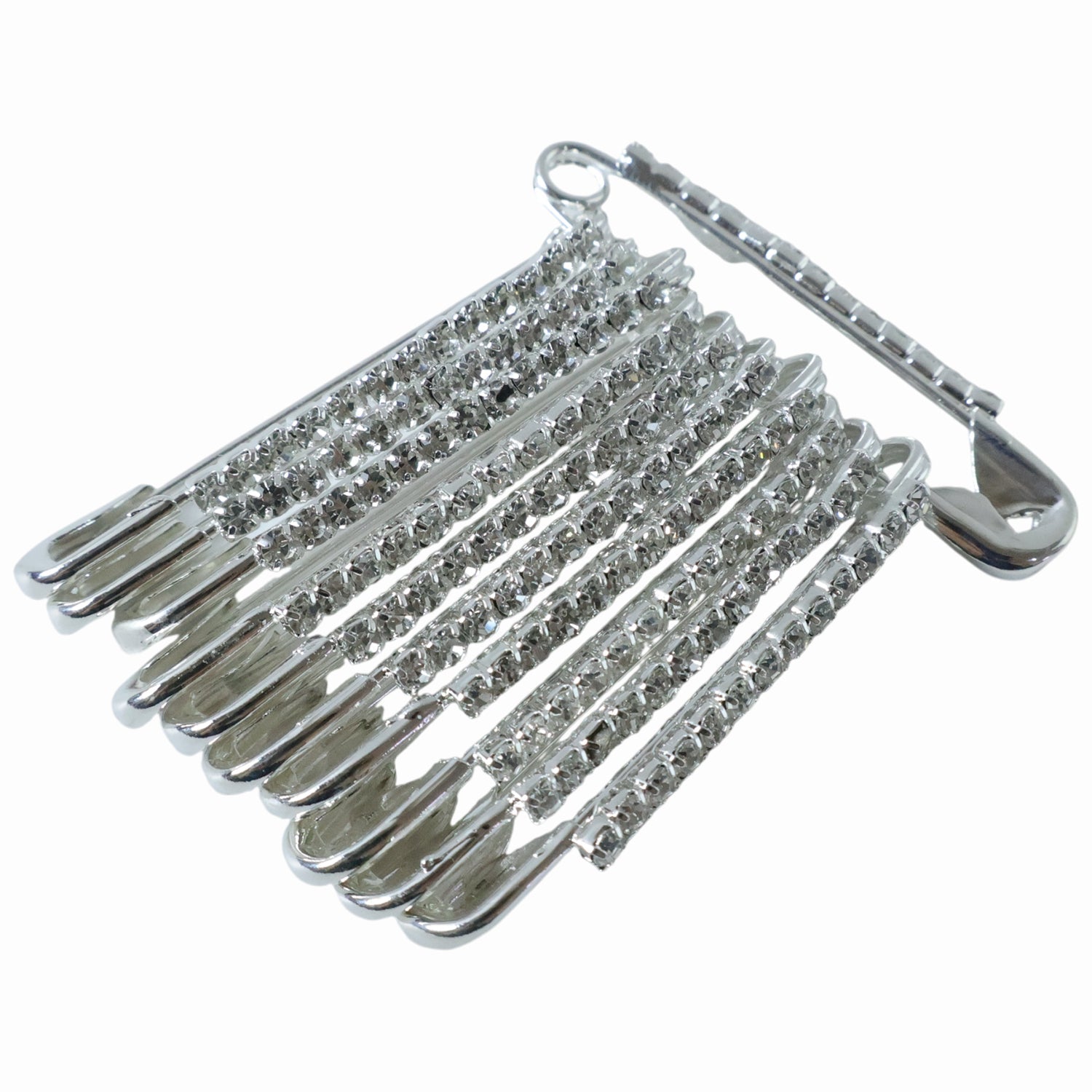 Multiple silver safety pins from the 12-piece decorative brooch set