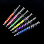 Collection of InkGlow fluorescent highlighter pens in various vibrant colors.