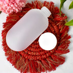 A squeezable 60ml travel bottle with a wide mouth, making refills and cleaning effortless for travelers.