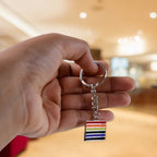 Rainbow metal keychain angled view displaying vibrant texture