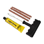 Essential tools from the tubeless tyre puncture repair kit ready for use.