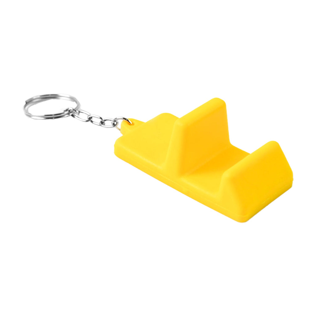 Go grip keychain stand used as phone holder on desk surface