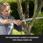 Gardener holding the portable hand pruning saw for quick trims.