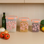 Close-up of the orange clip-lock lid on a floral airtight storage container.