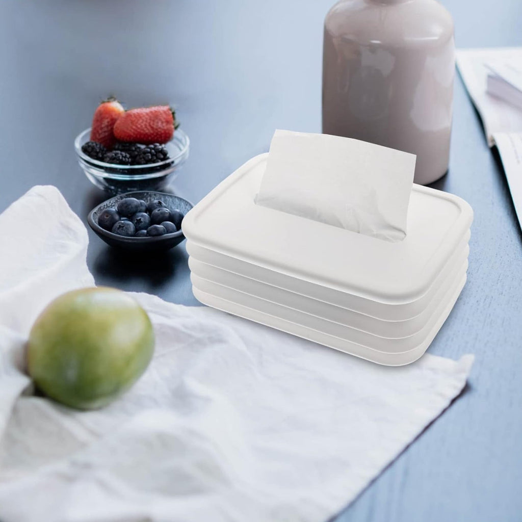 Wave-shaped silicone tissue dispenser keeps desk tidy in an office.