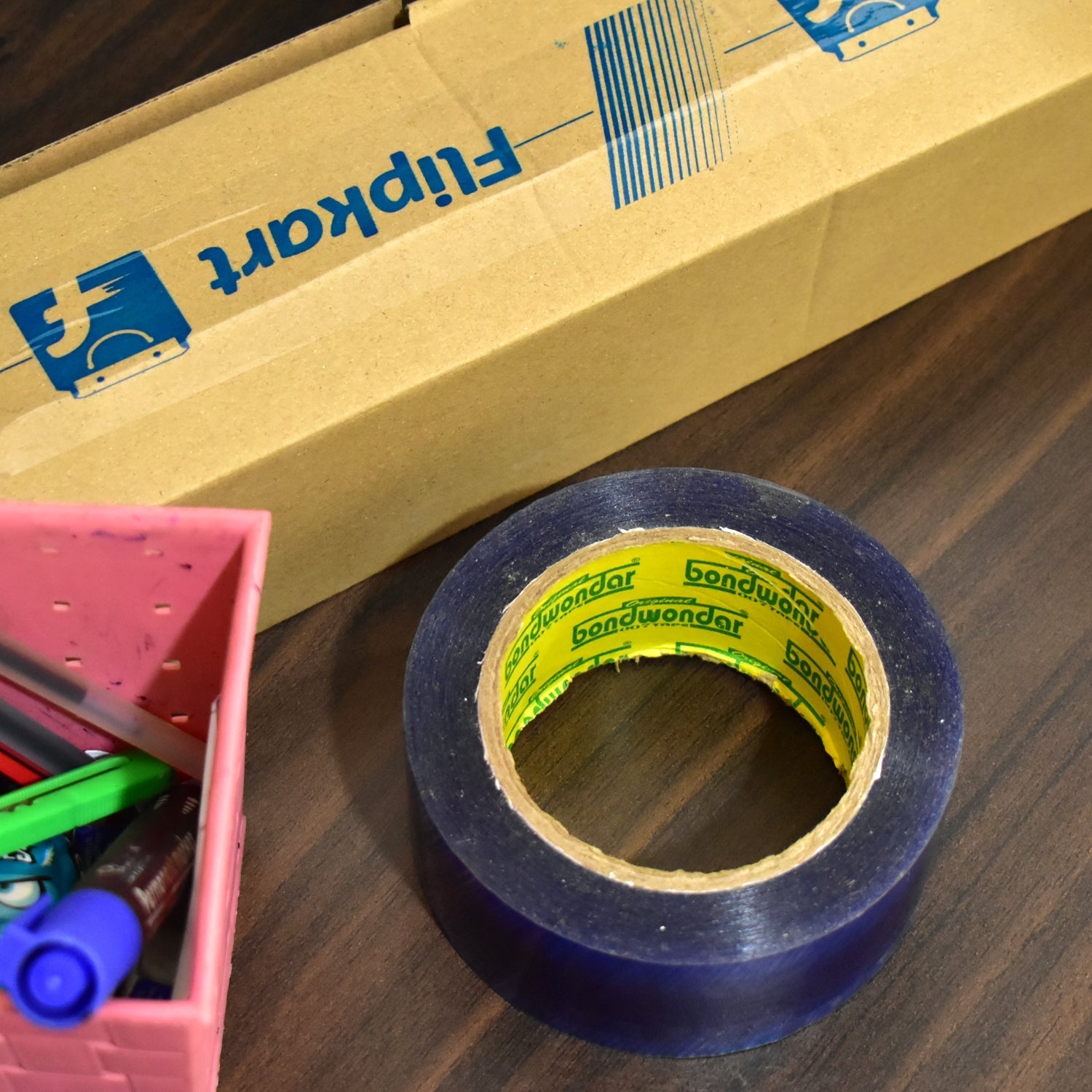 Flipkart blue adhesive tape roll, perfect for gift wrapping.