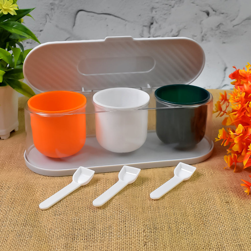 Multicolor 3-grid spice box with individual spoons for organised masala storage.