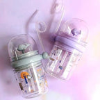 The Whale Spray Sippy Cup disassembled for easy cleaning, highlighting its simple components.