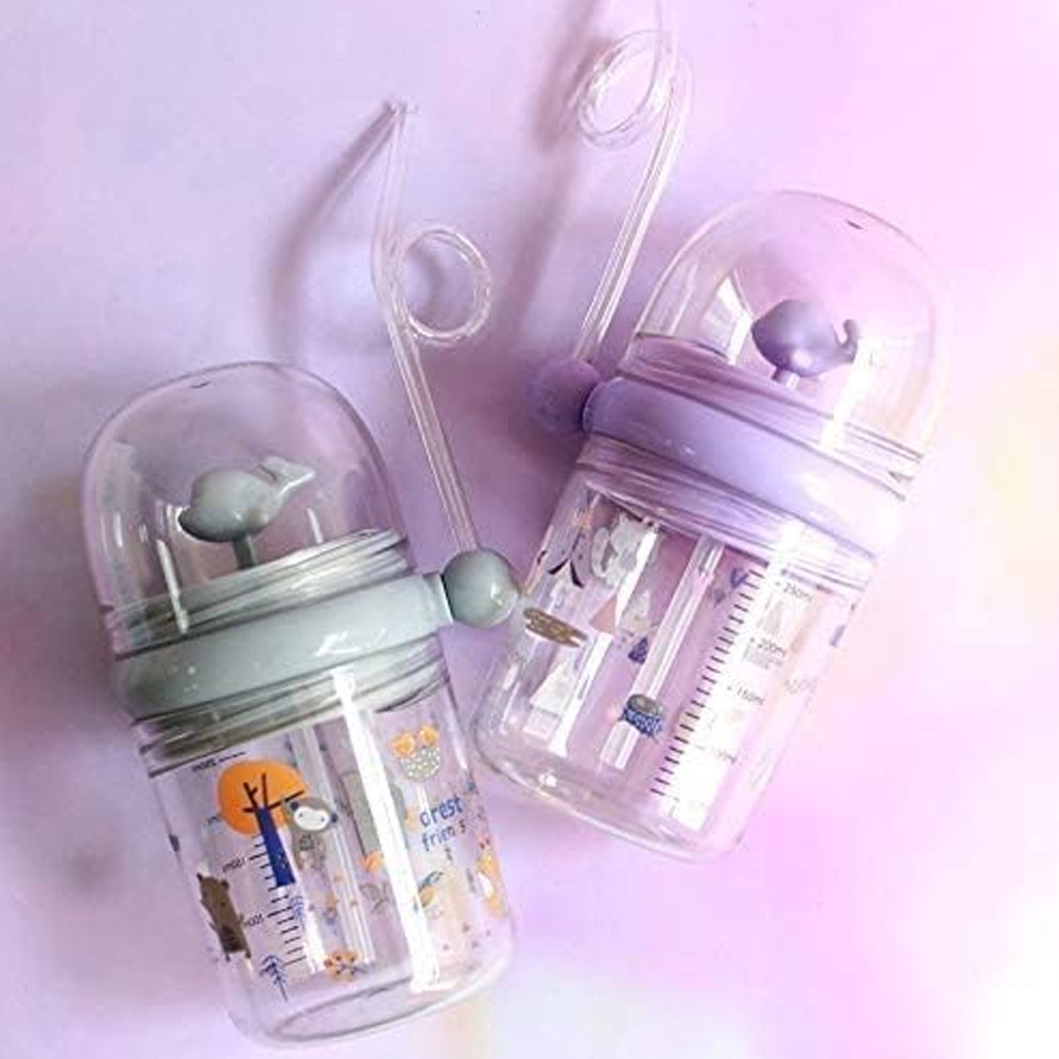 The Whale Spray Sippy Cup disassembled for easy cleaning, highlighting its simple components.
