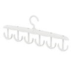 Side view of the space-saving tank top hanger with garments, showcasing its slim profile.