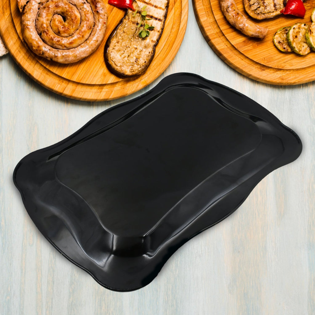 The versatile stainless steel serving tray displayed in a modern kitchen setting.