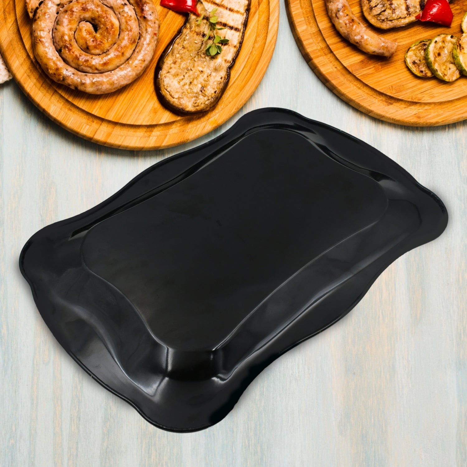 The versatile stainless steel serving tray displayed in a modern kitchen setting.