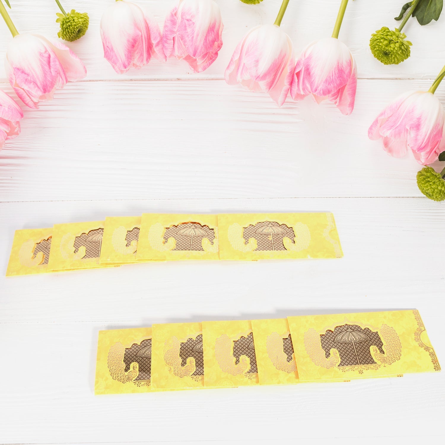 Beautifully scattered Indian celebration envelopes highlighting their diverse patterns.