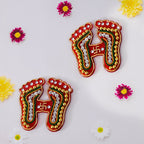 Laxmi Charan Paduka Sticker with traditional footprints and bead embellishments for festive home decor