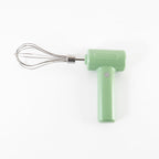 User holding the handheld Cordless Electric Whisk in a modern kitchen setting.
