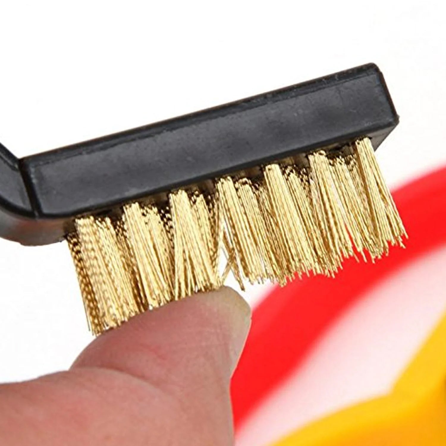 Side angle view of the mini brass wire brush, highlighting its construction.