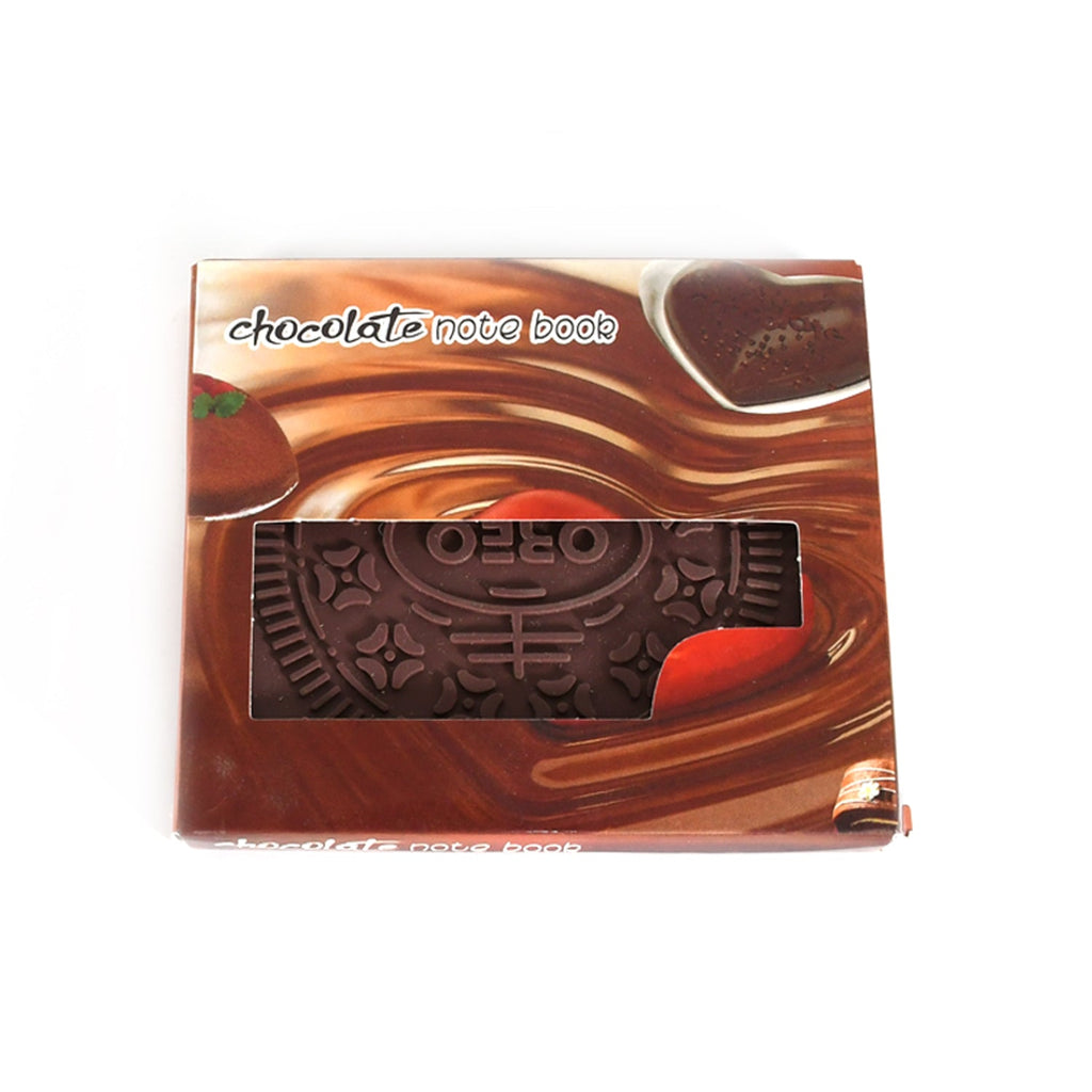 Several chocolate scented notebooks arranged on a desk.