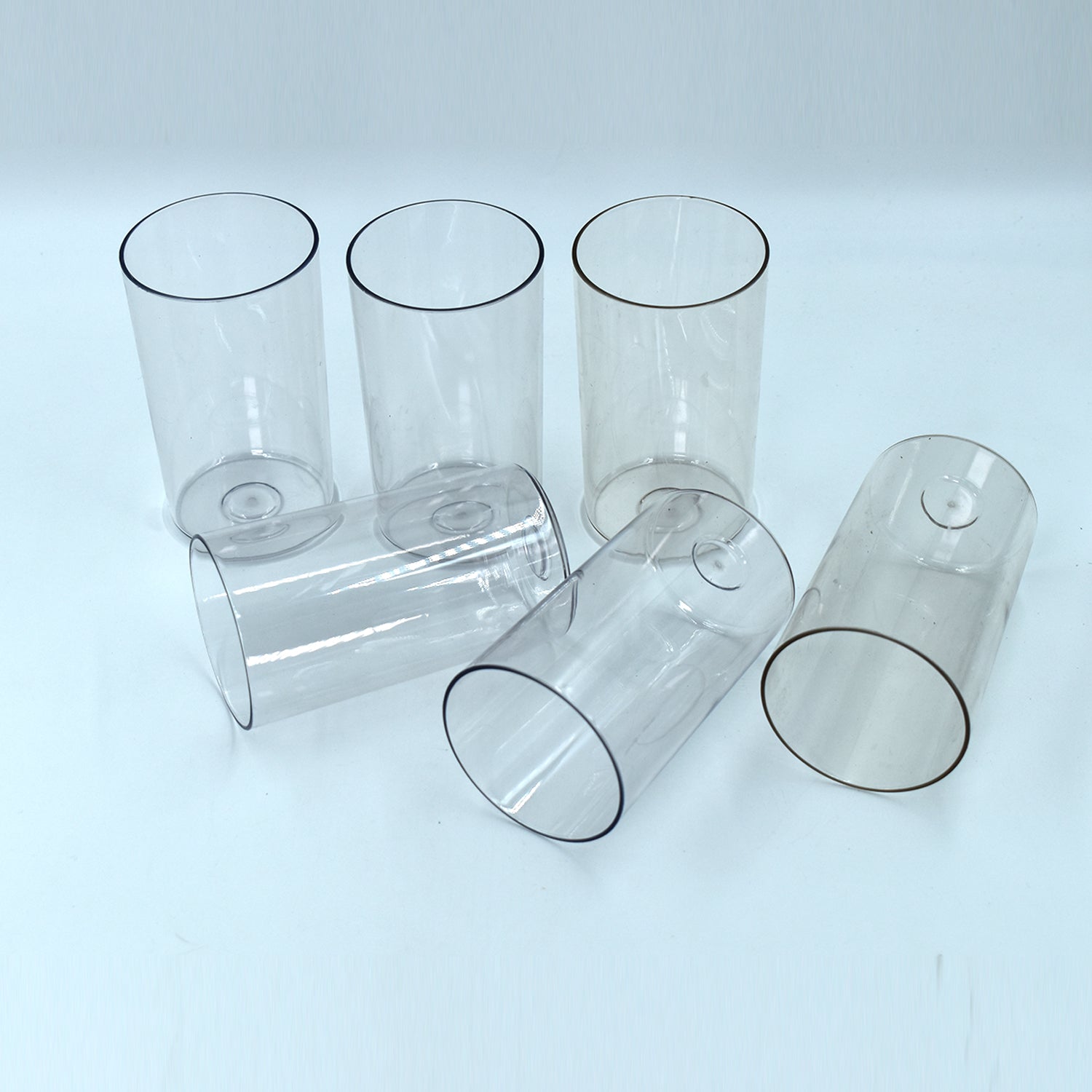 Ganesh Classic Plastic Glasses Set of 6 transparent tumblers, showcasing durability.