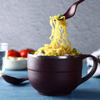 Ganesh brand insulated steel bowl with spoon and fork.