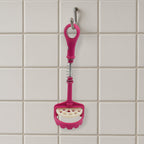 Easy-to-clean food-grade potato masher under running water.