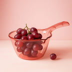 Close-up of ergonomic handle and spout on kitchen washing and straining bowl