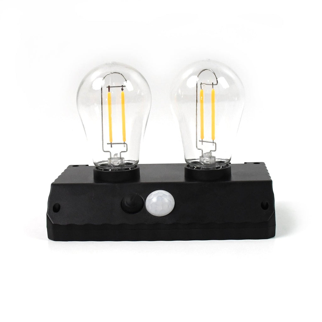 Two bright LED bulbs of the Indo Glow solar lamp clearly visible.