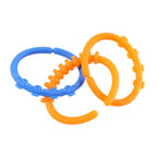 Three baby link rings showing bright colors and textured surfaces for teething