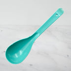 Collection of heat-resistant plastic serving spoons neatly arranged, ready for diverse culinary needs.