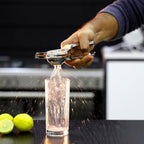 A sleek handheld citrus juicer made from premium stainless steel, ready for use in any kitchen.