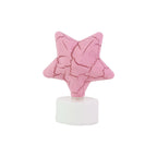 Group of flameless star shaped LED tealight candles shining softly