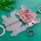 Bear-shaped clear plastic box, ideal for storing rings, earrings, and delicate jewelry.