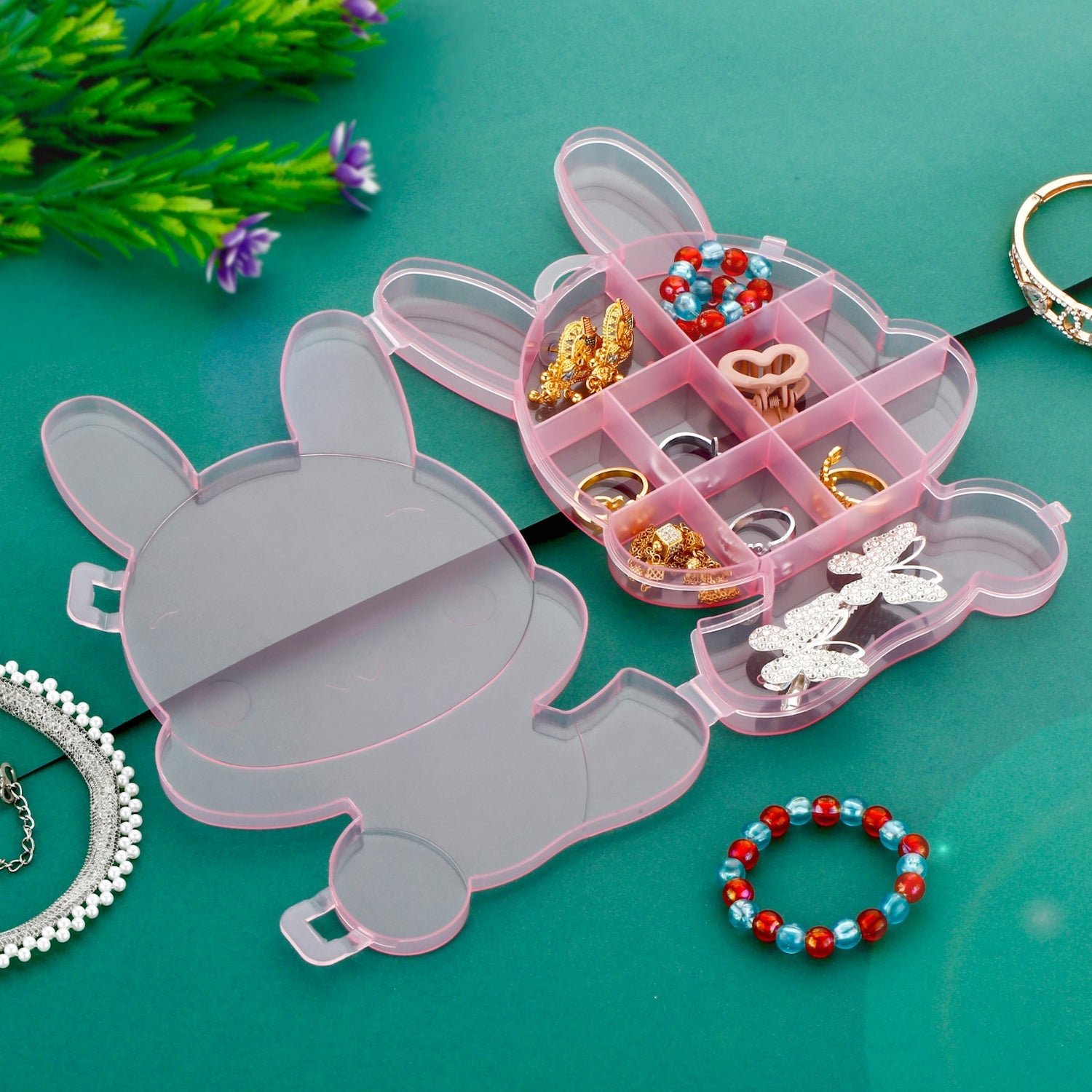 Bear-shaped clear plastic box, ideal for storing rings, earrings, and delicate jewelry.