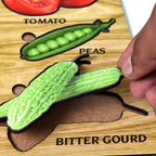 Individual wooden vegetable puzzle pieces, including corn and brinjal, separated from the board.