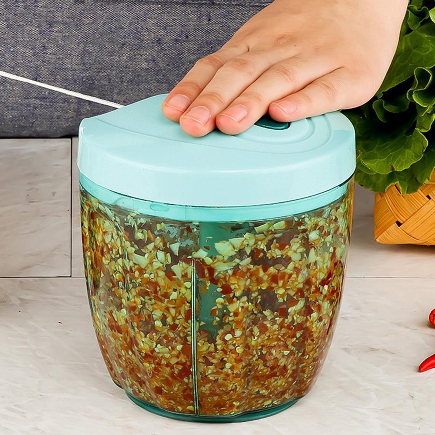 Hand-held vegetable slicer equipped with 5 extra sharp stainless steel blades.