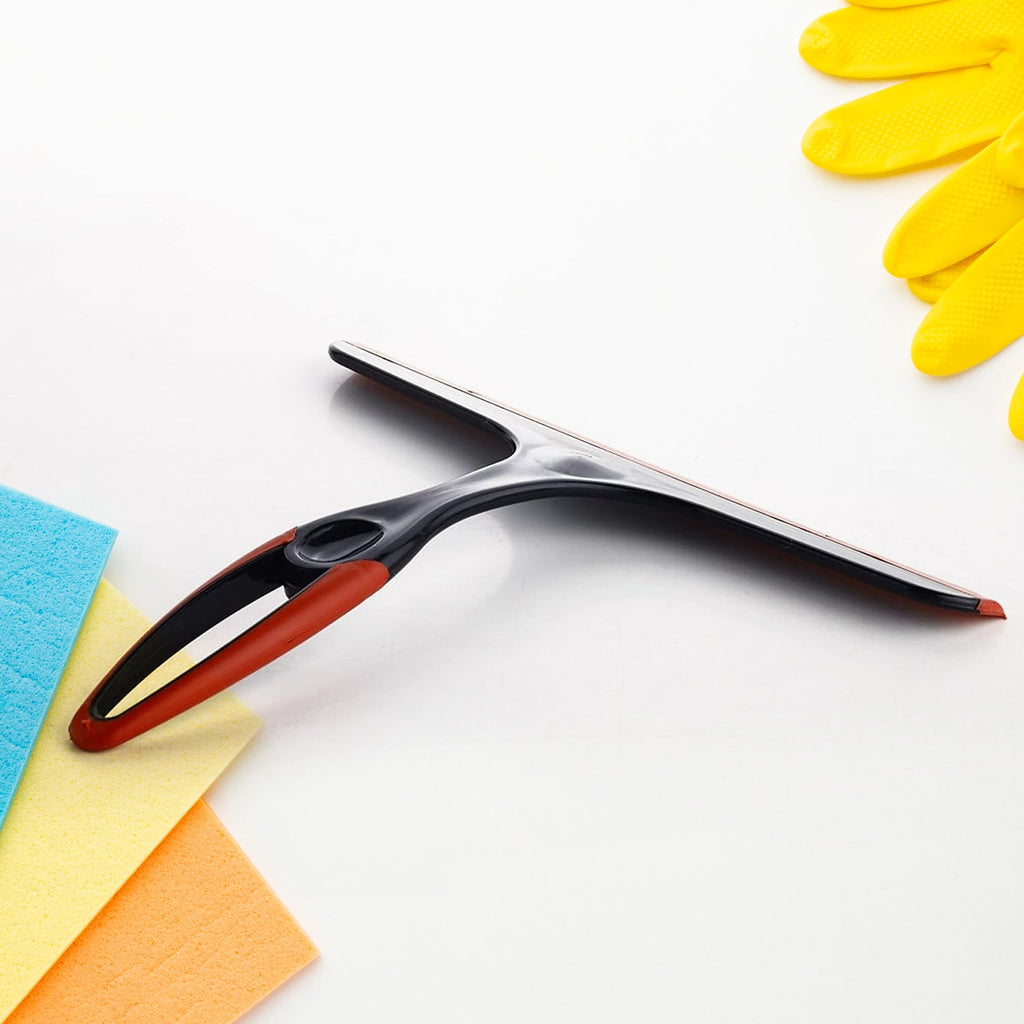 Kitchen wiper in action, gliding smoothly across a glass surface for quick drying.