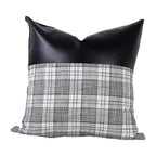 Stylish Leather & Cotton Pillow Cover adding a chic touch to a home interior.