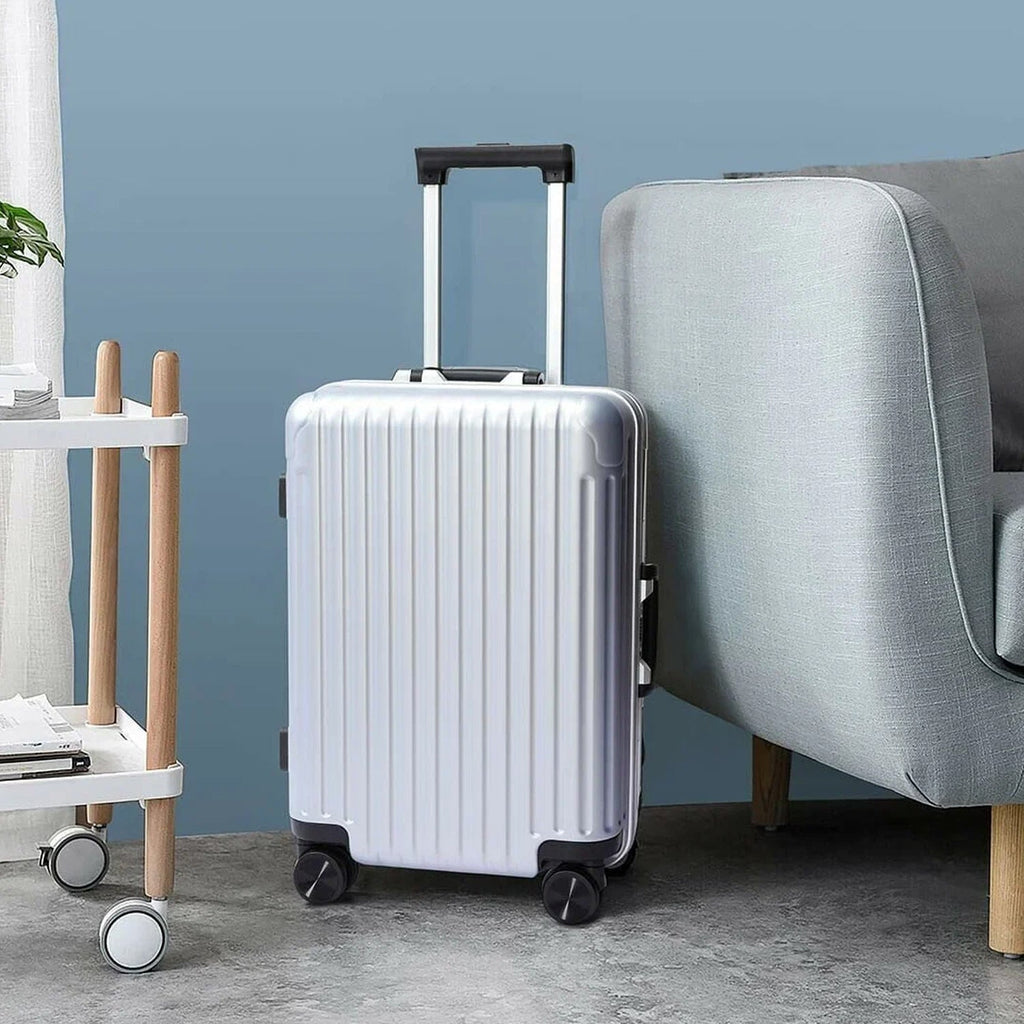A vibrant multi-color trolley bag set displayed open, showcasing spacious interiors.
