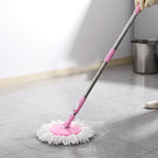 User demonstrating the simple hands-free wringing action with the Quick Spin Mop.